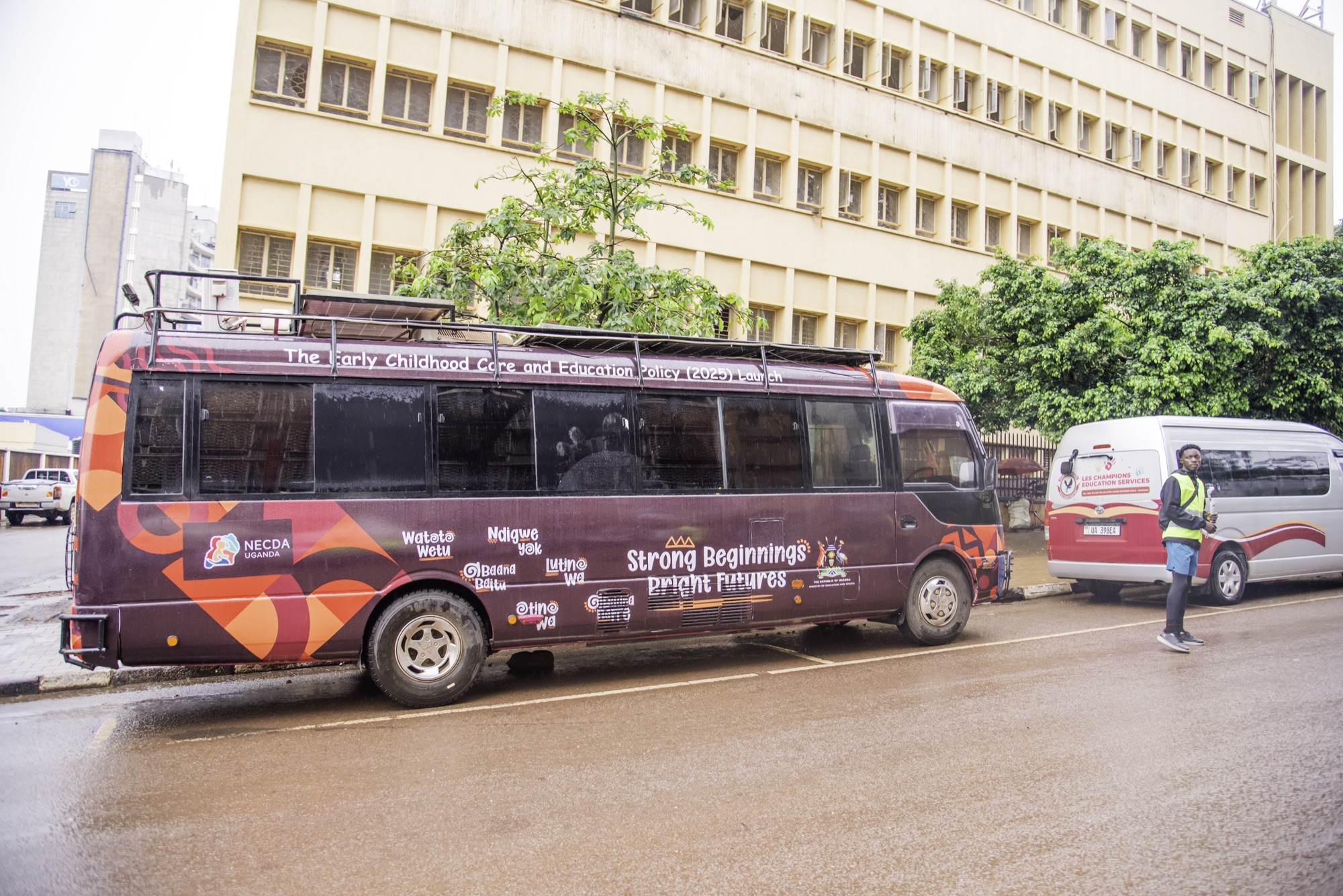Bus wrapped in the Strong Beginnings Bright Futures campaign identity