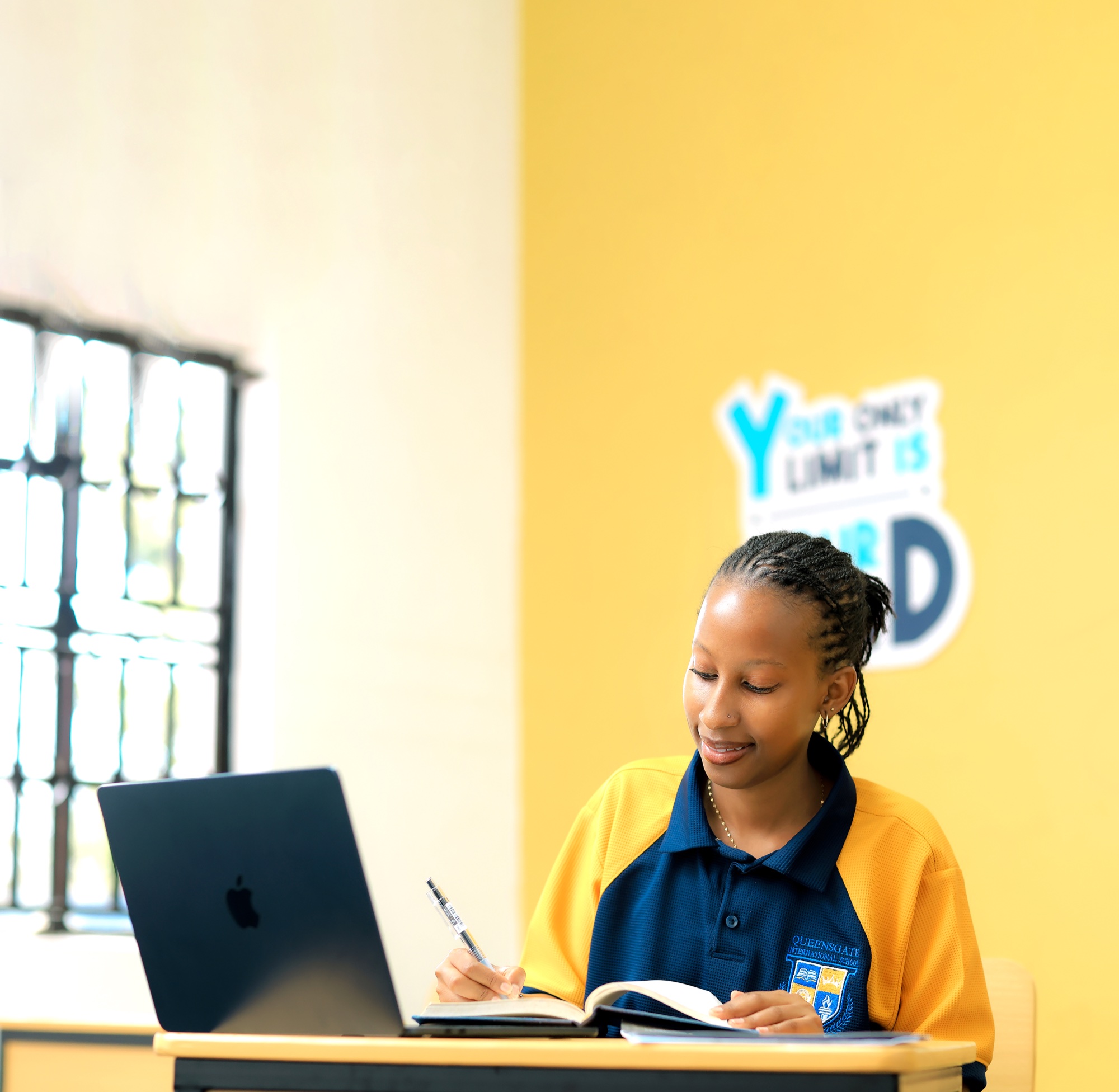 Queensgate student working in a branded learning environment